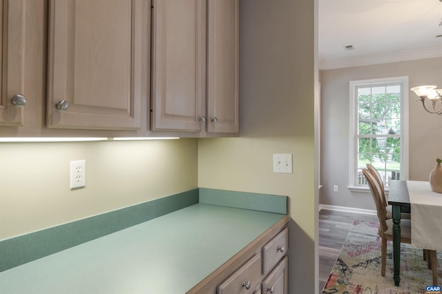 1875 Clay Dr, Crozet, VA 22932 - kitchen featuring crown molding, wood finished floors, light brown cabinetry, a chandelier, and light countertops