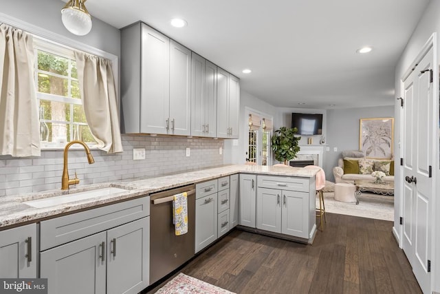 11606 New Bond St, Fredericksburg, VA 22408 - kitchen featuring stainless steel dishwasher, a sink, a peninsula, decorative backsplash, and recessed lighting