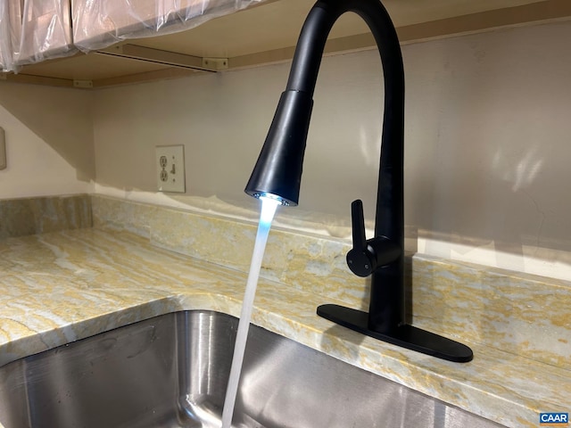 kitchen view of a sink and backsplash