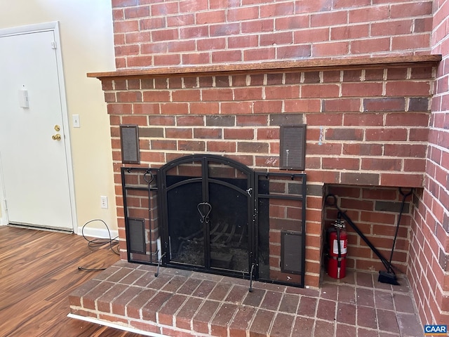 125 Turtle Creek Rd Unit 9, Charlottesville, VA 22901 - detailed view of wood finished floors and a brick fireplace