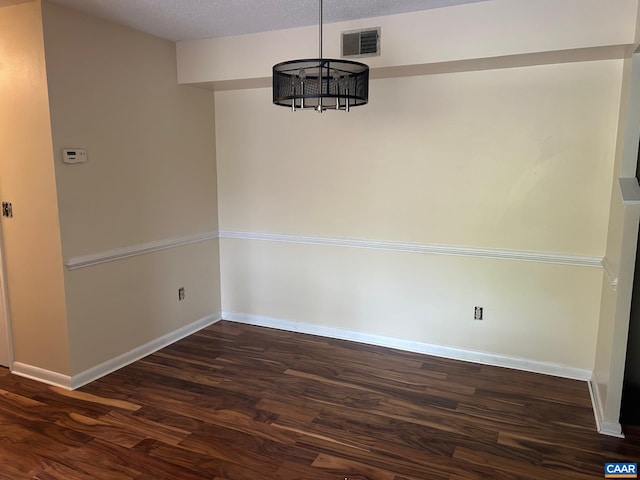 125 Turtle Creek Rd Unit 9, Charlottesville, VA 22901 - unfurnished dining area with dark wood-type flooring and a textured ceiling