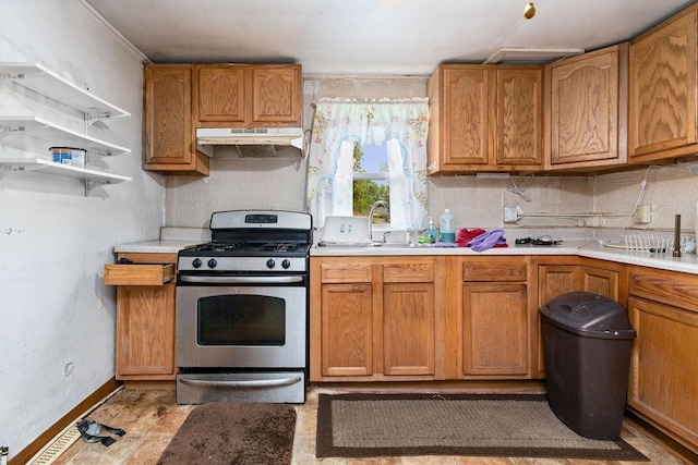 267 Shiloh Ave, Waynesboro, VA 22980 - kitchen featuring gas range, a sink, under cabinet range hood, light countertops, and decorative backsplash