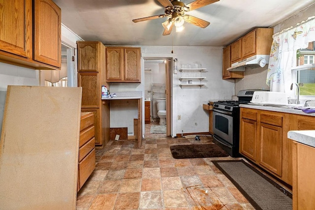 267 Shiloh Ave, Waynesboro, VA 22980 - kitchen featuring stainless steel range with gas cooktop, ceiling fan, under cabinet range hood, light stone finish flooring, and light countertops