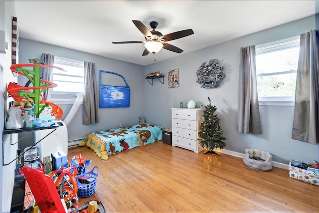 5226 Dogwood Dr, Mount Jackson, VA 22842 - bedroom featuring a baseboard heating unit, wood finished floors, and ceiling fan