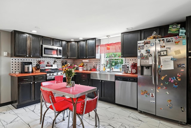 5226 Dogwood Dr, Mount Jackson, VA 22842 - kitchen featuring appliances with stainless steel finishes, light marble finish floors, tasteful backsplash, and recessed lighting