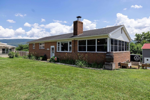 5226 Dogwood Dr, Mount Jackson, VA 22842 - rear view of house with brick siding, a chimney, a sunroom, and a mountain view