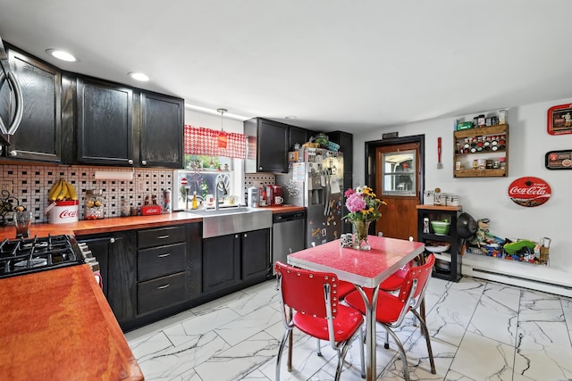5226 Dogwood Dr, Mount Jackson, VA 22842 - kitchen with light marble finish flooring, dark cabinetry, stainless steel appliances, wooden counters, and recessed lighting