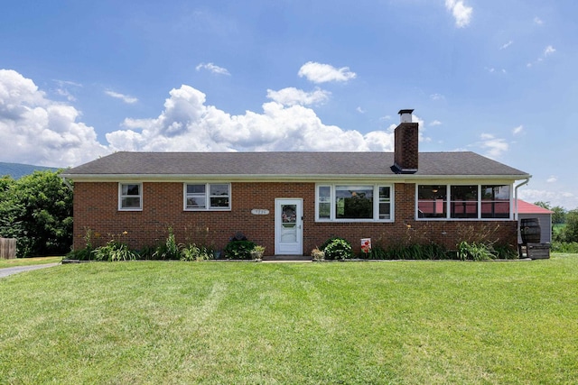 5226 Dogwood Dr, Mount Jackson, VA 22842 - view of front facade with a chimney, a front lawn, and brick siding