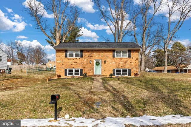 bi-level home with a front yard