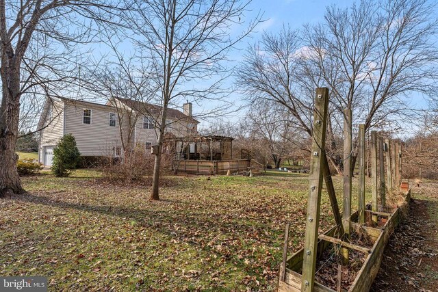 view of yard featuring a wooden deck