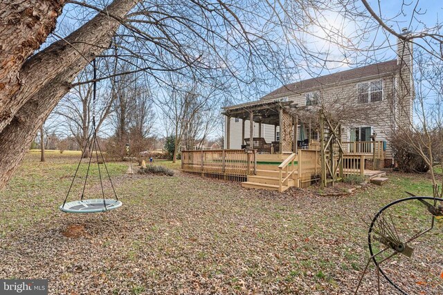 view of yard with a pergola and a deck