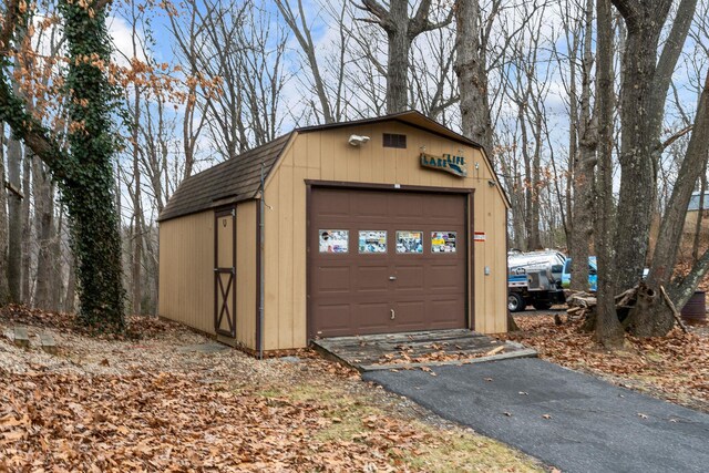 detached garage with aphalt driveway