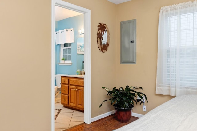 88 Ashleigh Dr, Waynesboro, VA 22980 - bedroom featuring electric panel, baseboards, connected bathroom, and light tile patterned floors