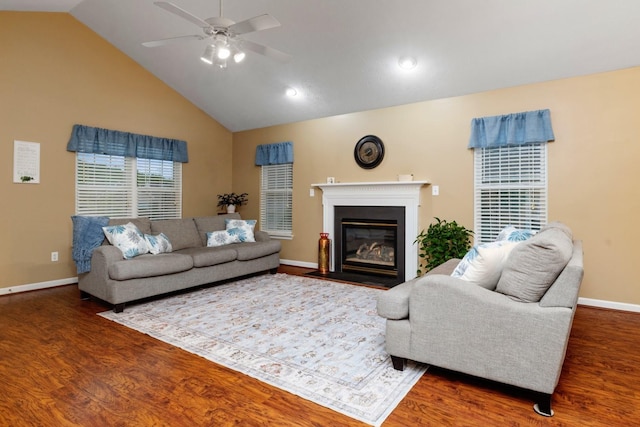 88 Ashleigh Dr, Waynesboro, VA 22980 - living room featuring wood finished floors, a ceiling fan, baseboards, vaulted ceiling, and a fireplace with flush hearth