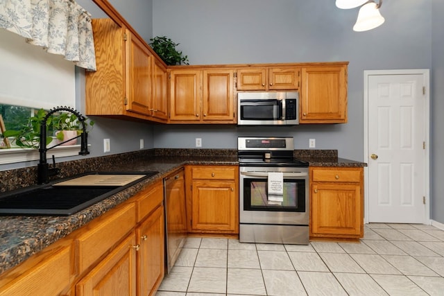 88 Ashleigh Dr, Waynesboro, VA 22980 - kitchen with appliances with stainless steel finishes, a sink, and brown cabinetry