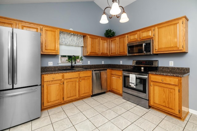88 Ashleigh Dr, Waynesboro, VA 22980 - kitchen featuring appliances with stainless steel finishes, a sink, light tile patterned floors, a chandelier, and brown cabinetry