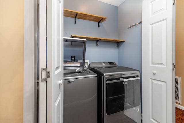88 Ashleigh Dr, Waynesboro, VA 22980 - laundry room featuring washer and clothes dryer and wood finished floors