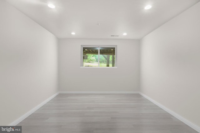  - spare room with recessed lighting, light wood finished floors, and baseboards