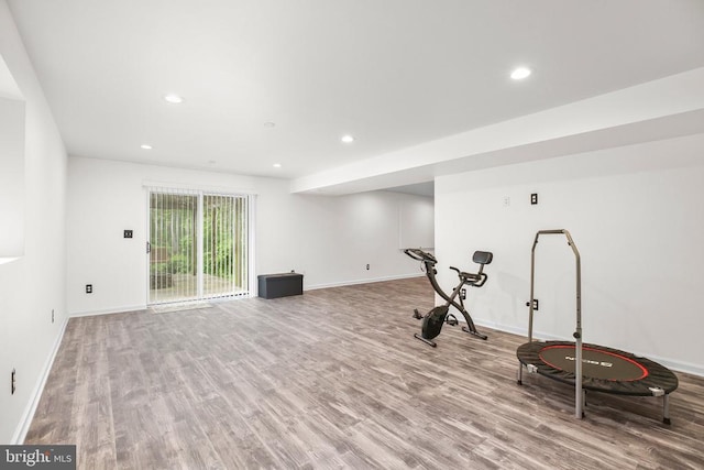  - workout room featuring wood finished floors, baseboards, and recessed lighting