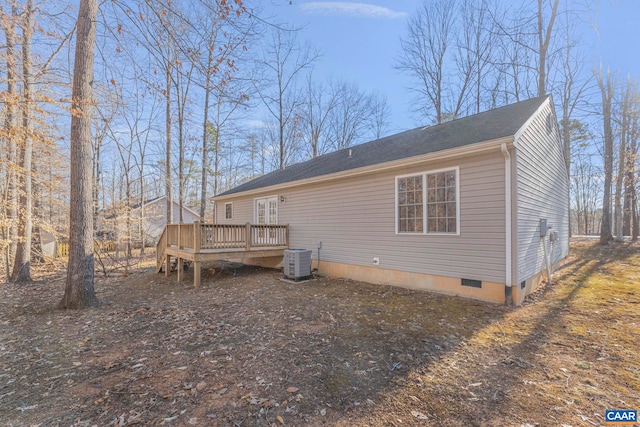 back of property with a wooden deck, central AC, and crawl space