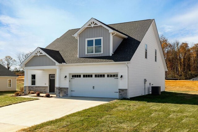 LOT154 Langley Dr, Waynesboro, VA 22980 - view of front facade featuring board and batten siding, a front lawn, a garage, stone siding, and roof with shingles