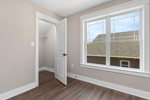 LOT154 Langley Dr, Waynesboro, VA 22980 - unfurnished bedroom with dark wood-style flooring, baseboards, a walk in closet, and a closet
