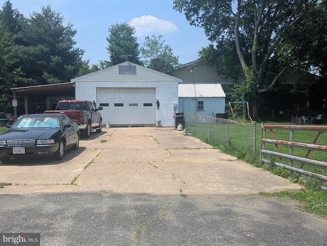 10834 Tidewater Trl, Fredericksburg, VA 22408 - view of front of house with a detached garage and an outbuilding