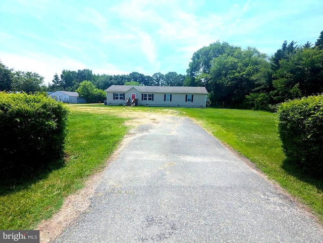 10834 Tidewater Trl, Fredericksburg, VA 22408 - single story home with driveway, a front yard, and view of wooded area