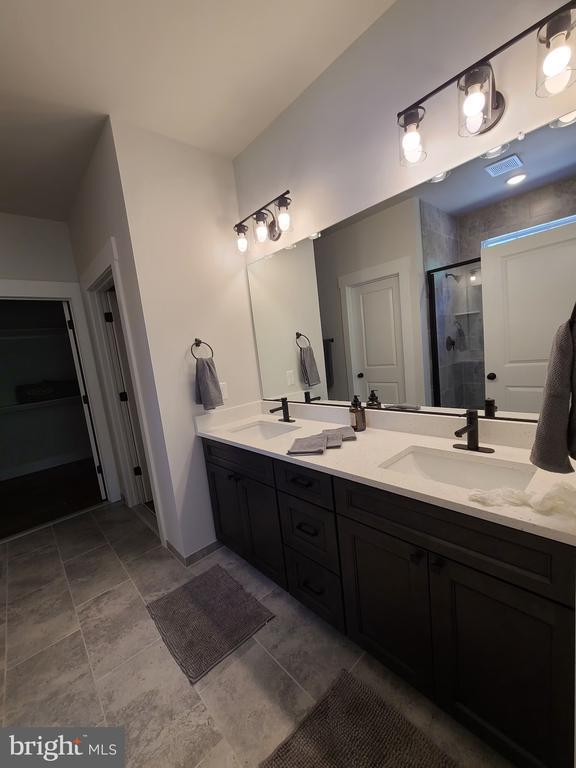 150 Winchester Trl, Mineral, VA 23117 - full bath with a shower stall, double vanity, and a closet