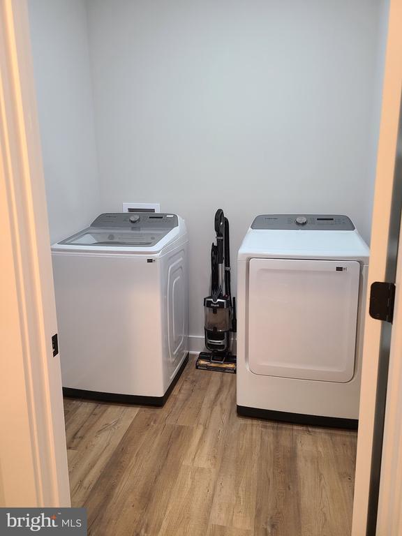 150 Winchester Trl, Mineral, VA 23117 - washroom with wood finished floors and washer and dryer