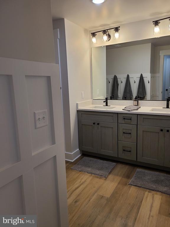 150 Winchester Trl, Mineral, VA 23117 - full bath featuring double vanity and wood finished floors