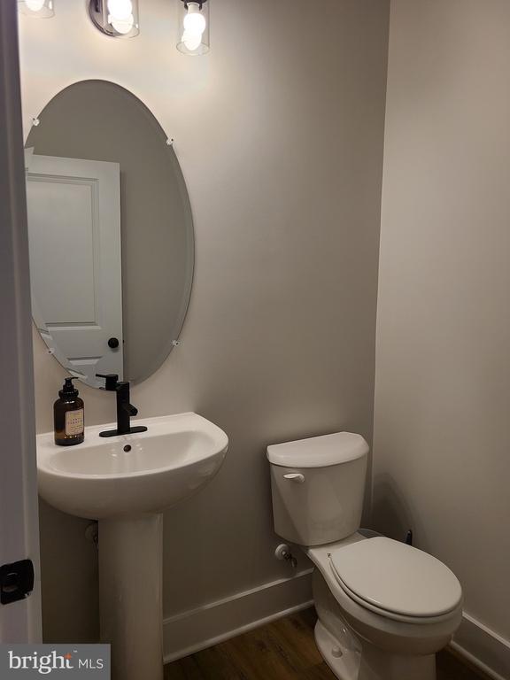150 Winchester Trl, Mineral, VA 23117 - half bath with baseboards and wood finished floors