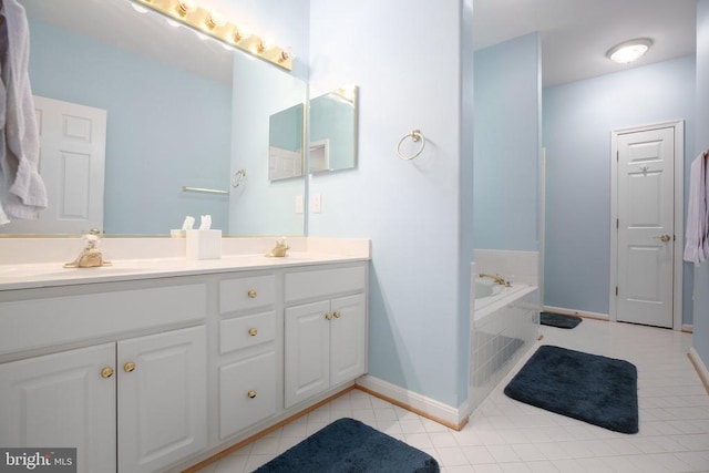 bathroom featuring tile patterned floors, baseboards, double vanity, and a bath