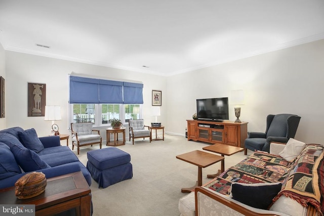 living area with crown molding and light colored carpet