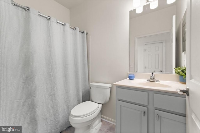  - bathroom featuring toilet, vanity, baseboards, and a shower with shower curtain