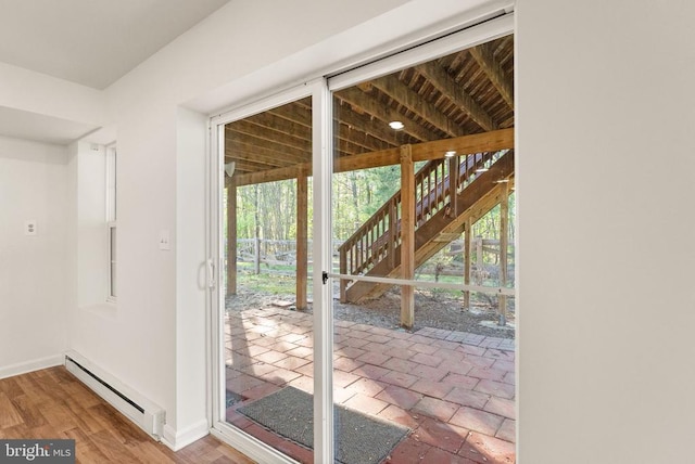  - entryway with a baseboard radiator and baseboards