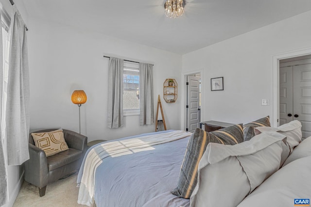 bedroom featuring light colored carpet