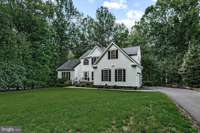 7924 Gold Leaf Cir, Spotsylvania, VA 22551 - traditional-style house featuring asphalt driveway, a front lawn, and a garage