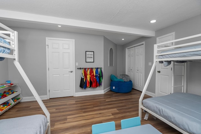 2003 Rinacas Corner Rd, Shenandoah, VA 22849 - bedroom with wood finished floors, recessed lighting, baseboards, a textured ceiling, and a closet