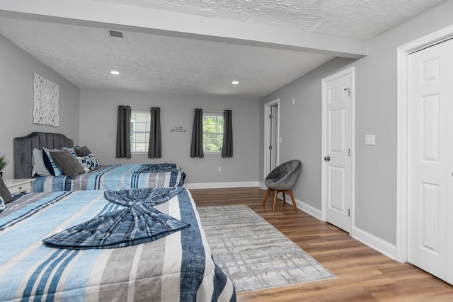 2003 Rinacas Corner Rd, Shenandoah, VA 22849 - bedroom with wood finished floors, a textured ceiling, baseboards, and recessed lighting