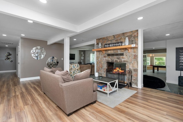 2003 Rinacas Corner Rd, Shenandoah, VA 22849 - living area featuring wood finished floors, a stone fireplace, baseboards, and recessed lighting