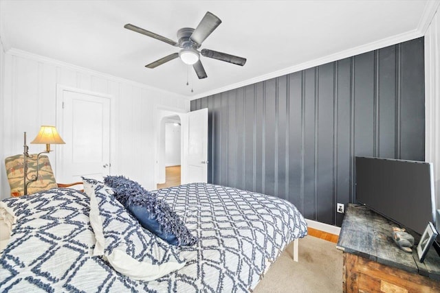 bedroom featuring crown molding, arched walkways, and ceiling fan
