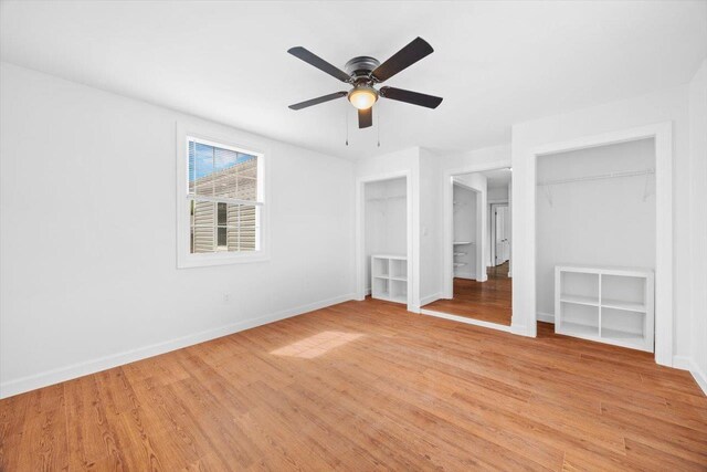 unfurnished bedroom featuring light wood-style flooring, baseboards, and a ceiling fan
