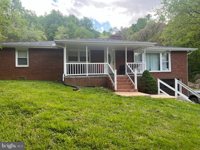 12134 Baylor Ln, Orange, VA 22960 - ranch-style house featuring brick siding, a front yard, covered porch, and stairs