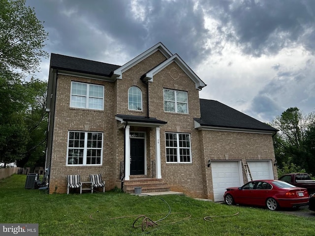 view of front of house featuring central air condition unit, a shingled roof, a front yard, and brick siding