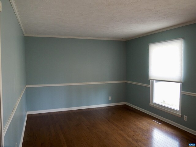 4646 Woods Edge Rd, Troy, VA 22974 - empty room with dark wood finished floors, a textured ceiling, baseboards, and crown molding