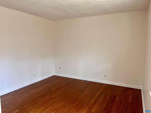 4646 Woods Edge Rd, Troy, VA 22974 - spare room with baseboards and dark wood-style flooring