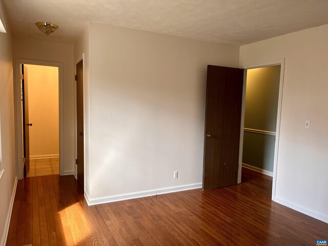 4646 Woods Edge Rd, Troy, VA 22974 - unfurnished bedroom featuring hardwood / wood-style flooring and baseboards
