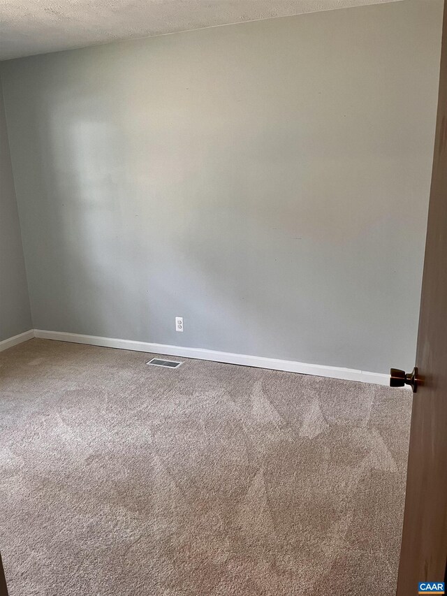 4646 Woods Edge Rd, Troy, VA 22974 - carpeted empty room featuring baseboards