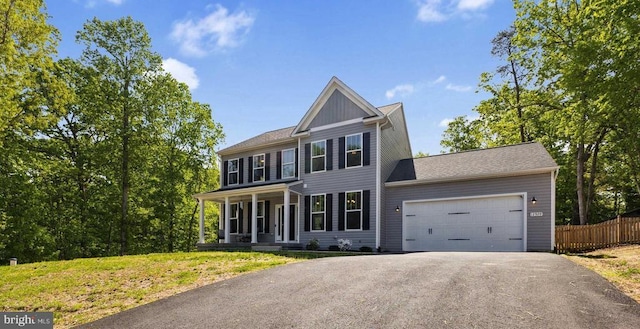 12929 Pipe Run Dr, Fredericksburg, VA 22407 - view of front of home featuring asphalt driveway, covered porch, and an attached garage